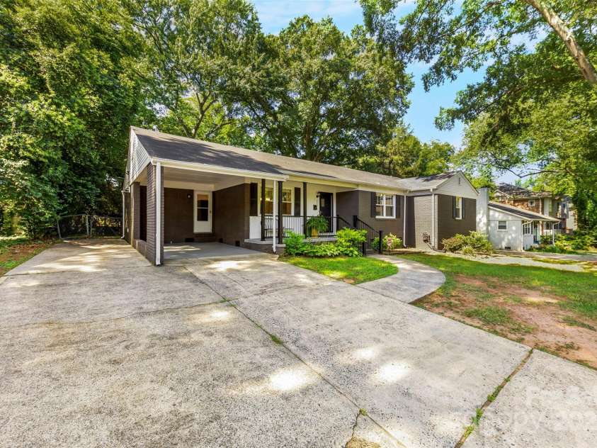 1126 Woodlawn Road, Charlotte, NC 28209.  MLS# CAR4281650, YatesRealty ID 27192. Spacious driveway with attached carport.