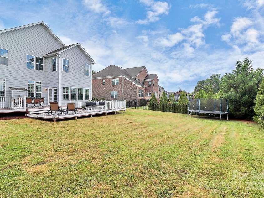 4156 Green Park Court, Harrisburg, NC 28075.  MLS# CAR4281279, YatesRealty ID 27193. Trampoline in fenced yard