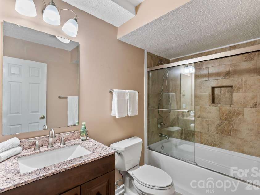 100 Thistle Knoll Court, Asheville, NC 28803.  MLS# CAR4355121, YatesRealty ID 27213. Lower bath