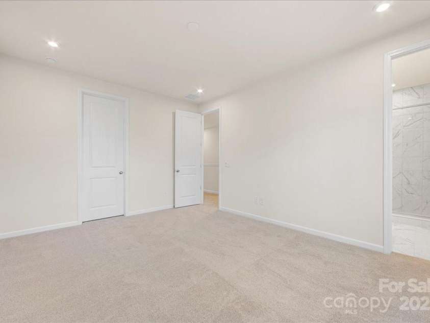 6009 Longar Lane, Charlotte, NC 28269.  MLS# CAR4283710, YatesRealty ID 27219. 9' Ceilings and 8' Doorways at Grand Primary Suite.