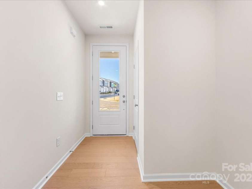 6009 Longar Lane, Charlotte, NC 28269.  MLS# CAR4283710, YatesRealty ID 27219. Front Foyer Through 8' Doorway.