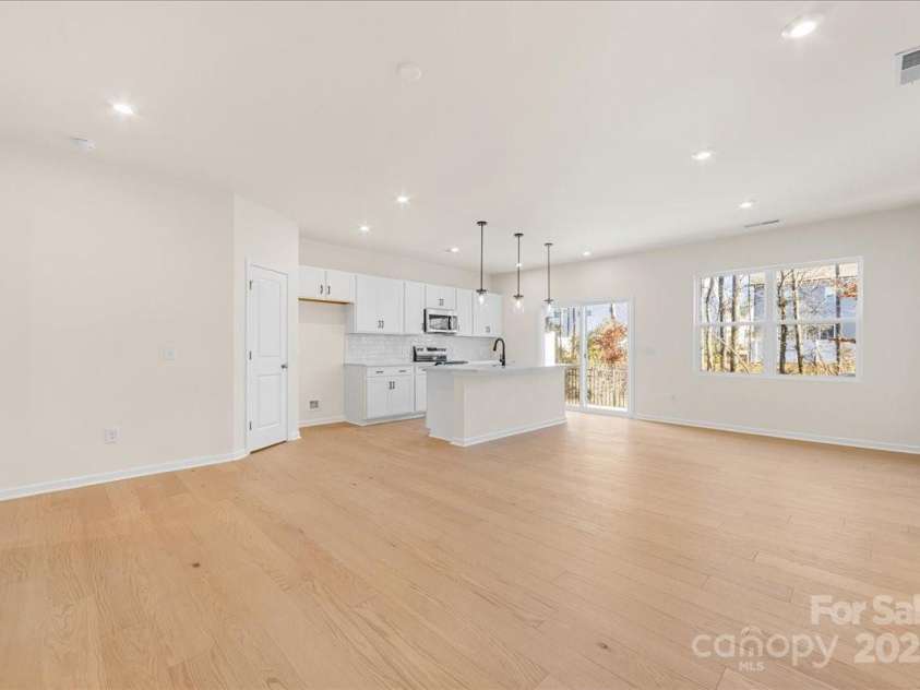 6009 Longar Lane, Charlotte, NC 28269.  MLS# CAR4283710, YatesRealty ID 27219. Seamlessly Blended Spaces so you Never Miss a Moment.