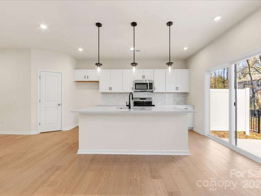 6009 Longar Lane, Charlotte, NC 28269.  MLS# CAR4283710, YatesRealty ID 27219. Sliding Glass Doors Creates Natural Indoor Outdoor Flow.