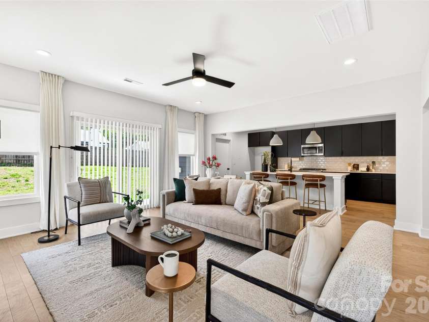 5044 Double Lakes Drive, Charlotte, NC 28212.  MLS# CAR4381424, YatesRealty ID 27220. Ceiling fan and sliders to fenced backyard.