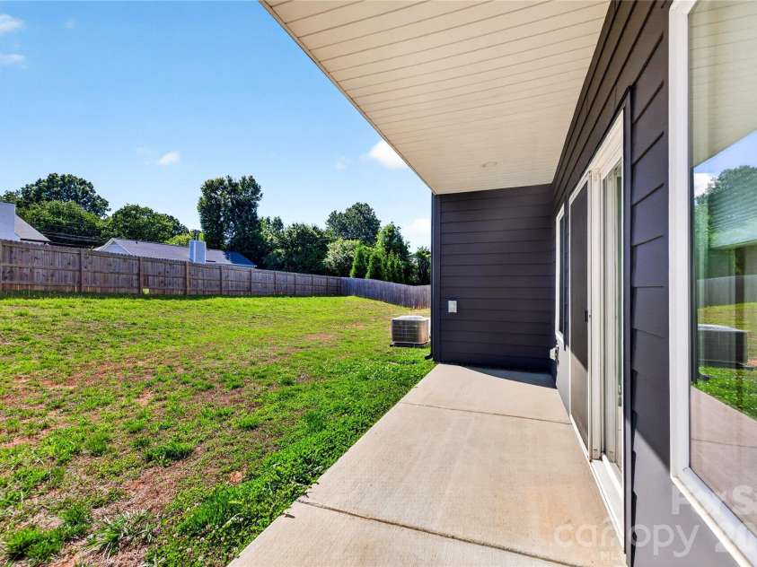 5044 Double Lakes Drive, Charlotte, NC 28212.  MLS# CAR4381424, YatesRealty ID 27220. Covered back porch.