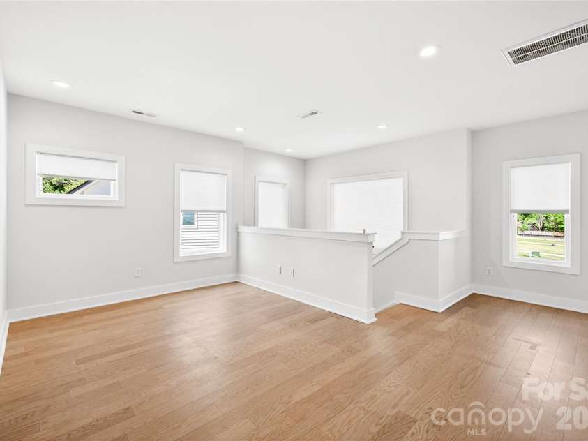 5044 Double Lakes Drive, Charlotte, NC 28212.  MLS# CAR4381424, YatesRealty ID 27220. Large loft.