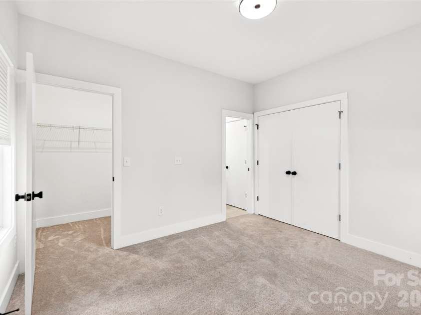 5044 Double Lakes Drive, Charlotte, NC 28212.  MLS# CAR4381424, YatesRealty ID 27220. Secondary bedroom also features a walk in closet.