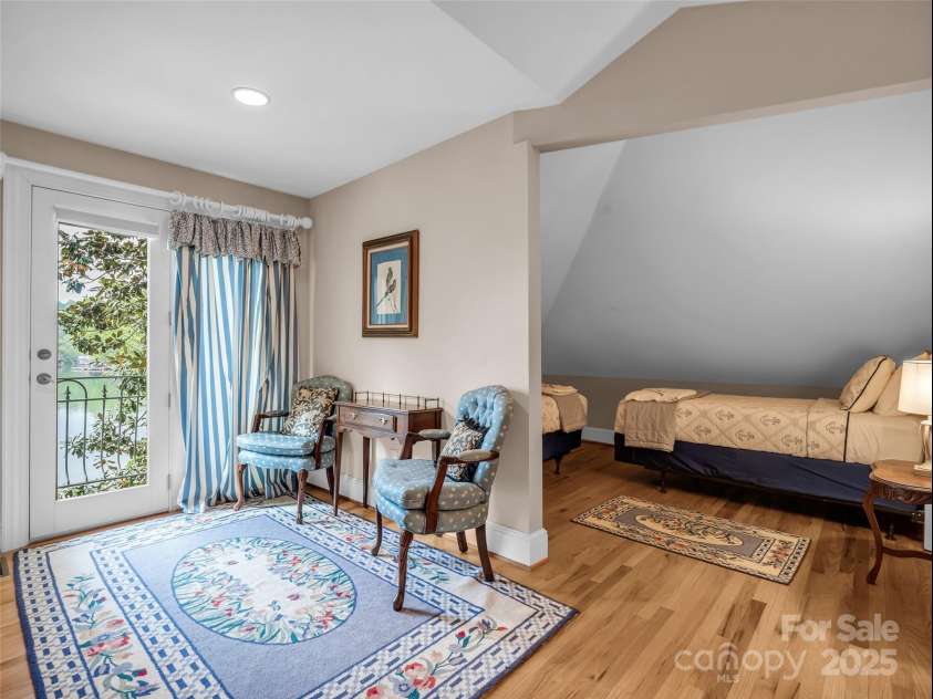 454 Cutaway Road, Lake Lure, NC 28746.  MLS# CAR4280370, YatesRealty ID 27231. 5th Bedroom Loft Upper Level with Juliette Balcony Overlooking Lake Lure