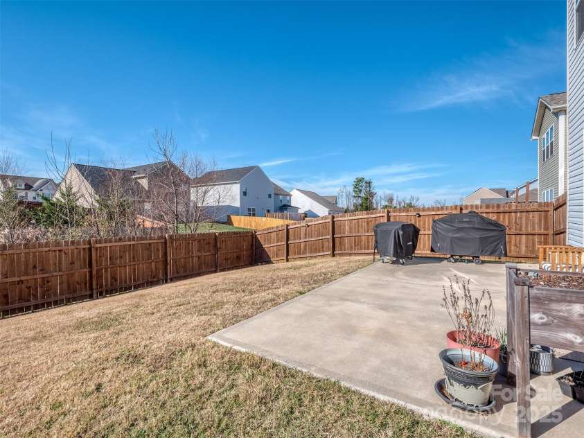 975 Bunker Trace, Rock Hill, SC 29730.  MLS# CAR4322751, YatesRealty ID 27232. Large rear patio and fenced yard!