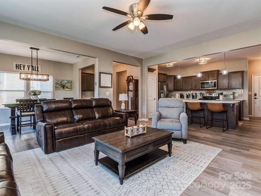 975 Bunker Trace, Rock Hill, SC 29730.  MLS# CAR4322751, YatesRealty ID 27232. The large great room is open to the kitchen and features luxury vinyl plank flooring.