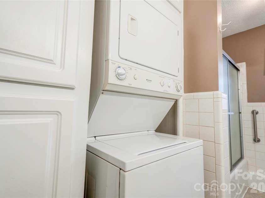 1516 Marlwood Drive, Shelby, NC 28150.  MLS# CAR4347021, YatesRealty ID 2724. Bath 2 laundry area contains stackable washer/dryer with will convey. It also has plenty of cabinet storage.