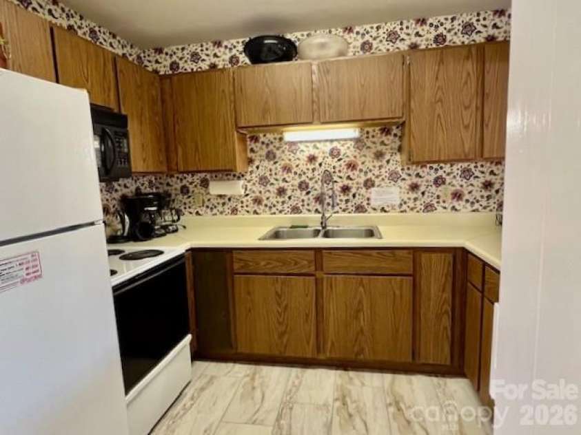 31 St Andrews Drive, Etowah, NC 28729.  MLS# CAR4379830, YatesRealty ID 27240. Community Center Kitchen