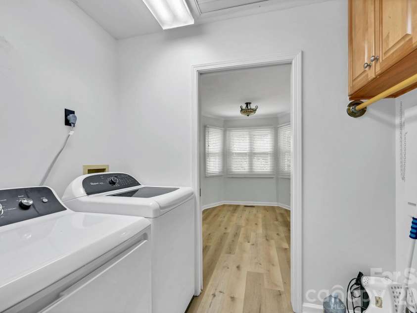 31 St Andrews Drive, Etowah, NC 28729.  MLS# CAR4379830, YatesRealty ID 27240. Laundry Located in Hallway with New Dryer (Gas & Electric Hookups)