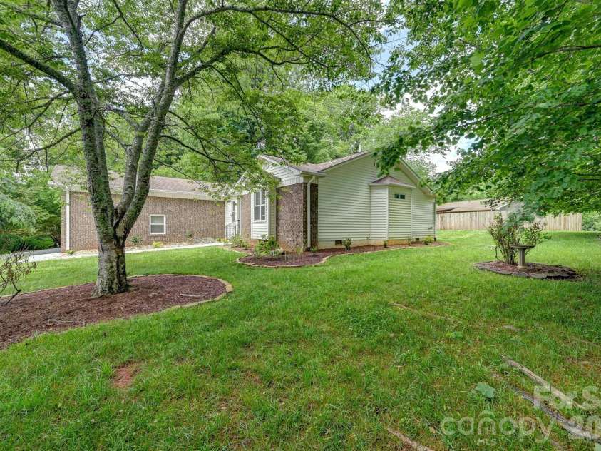 31 St Andrews Drive, Etowah, NC 28729.  MLS# CAR4379830, YatesRealty ID 27240. Side Yard