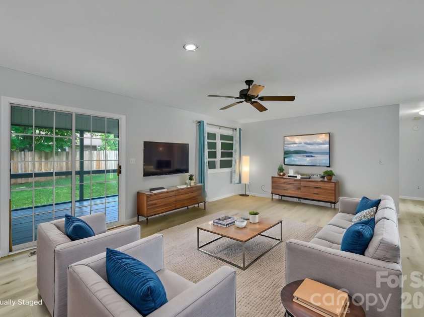 31 St Andrews Drive, Etowah, NC 28729.  MLS# CAR4379830, YatesRealty ID 27240. Spacious Living Room Virtually Staged View