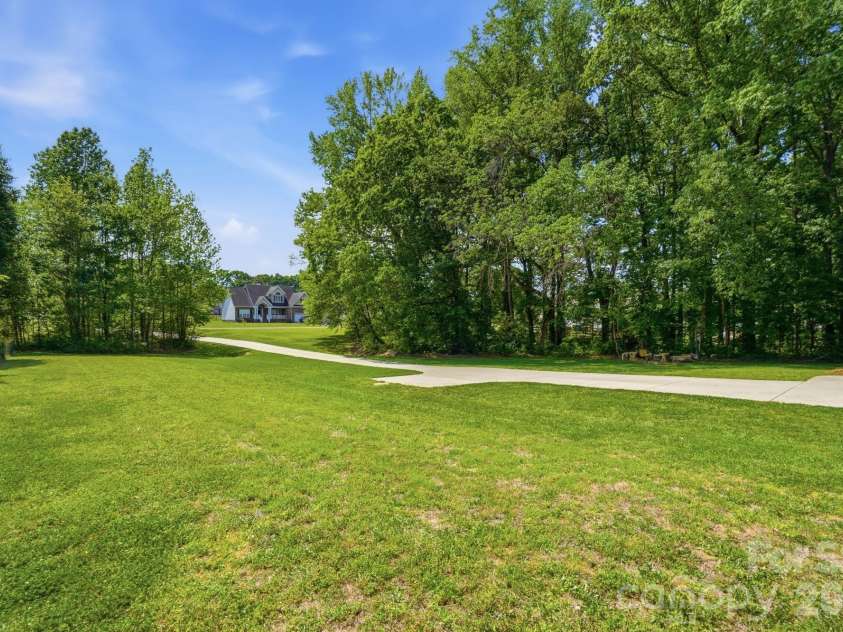 2910 Plum Thicket Court, Monroe, NC 28112.  MLS# CAR4370003, YatesRealty ID 27243. Front yard looking towards street