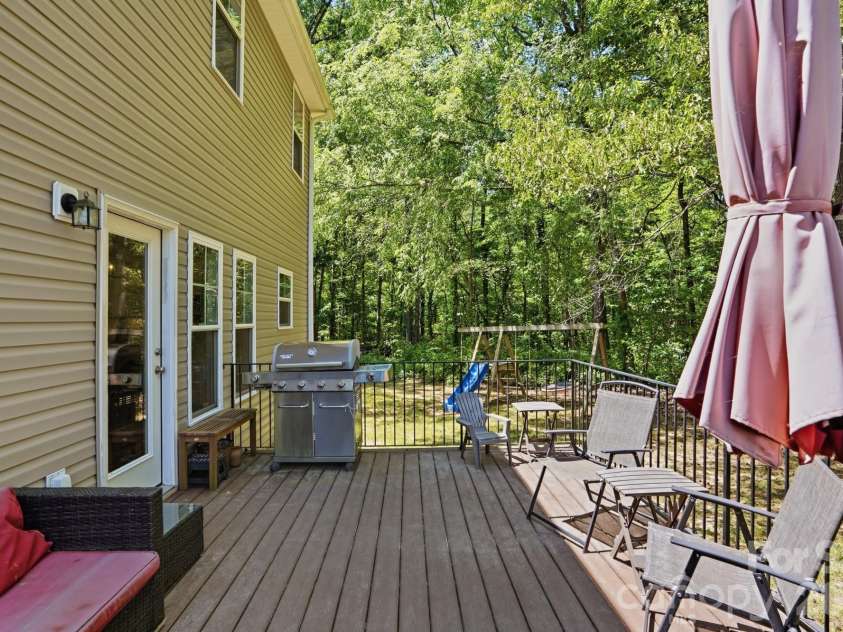 2910 Plum Thicket Court, Monroe, NC 28112.  MLS# CAR4370003, YatesRealty ID 27243. Large rear deck overlooking the wooded rear yard.