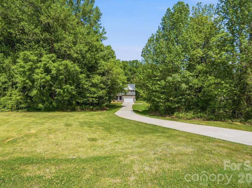 2910 Plum Thicket Court, Monroe, NC 28112.  MLS# CAR4370003, YatesRealty ID 27243. Long driveway!