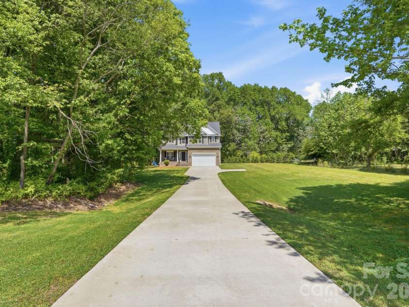 2910 Plum Thicket Court, Monroe, NC 28112.  MLS# CAR4370003, YatesRealty ID 27243. Look at that long concrete driveway!