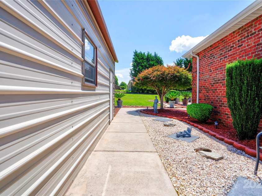 116 Camille Drive, Shelby, NC 28150.  MLS# CAR4272201, YatesRealty ID 27244. Side walk to pool