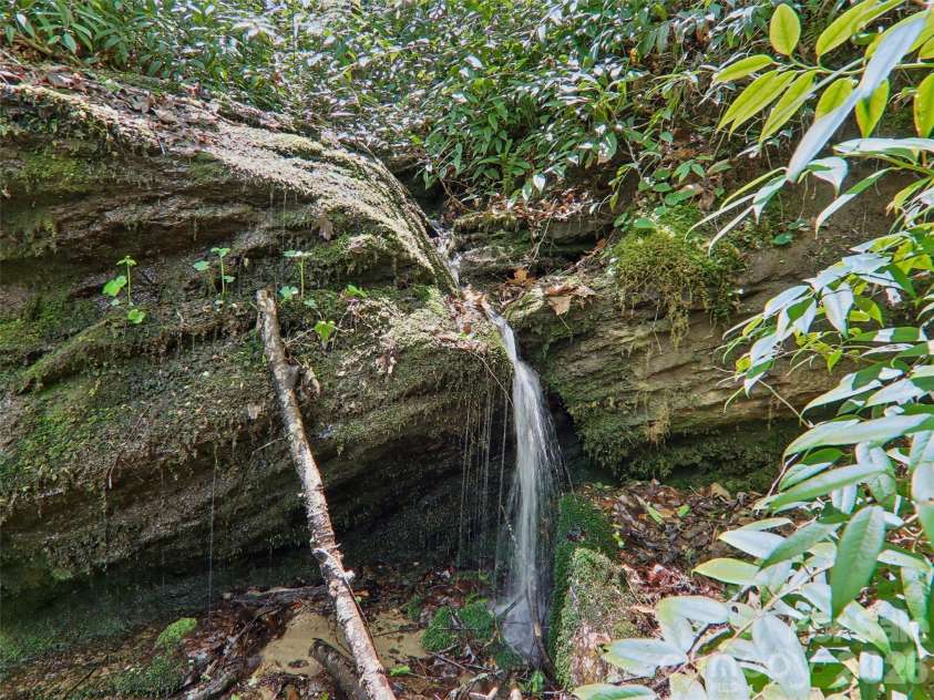 554 Pisgah Forest Drive, Pisgah Forest, NC 28768.  MLS# CAR4375652, YatesRealty ID 27244. Small Waterfall
