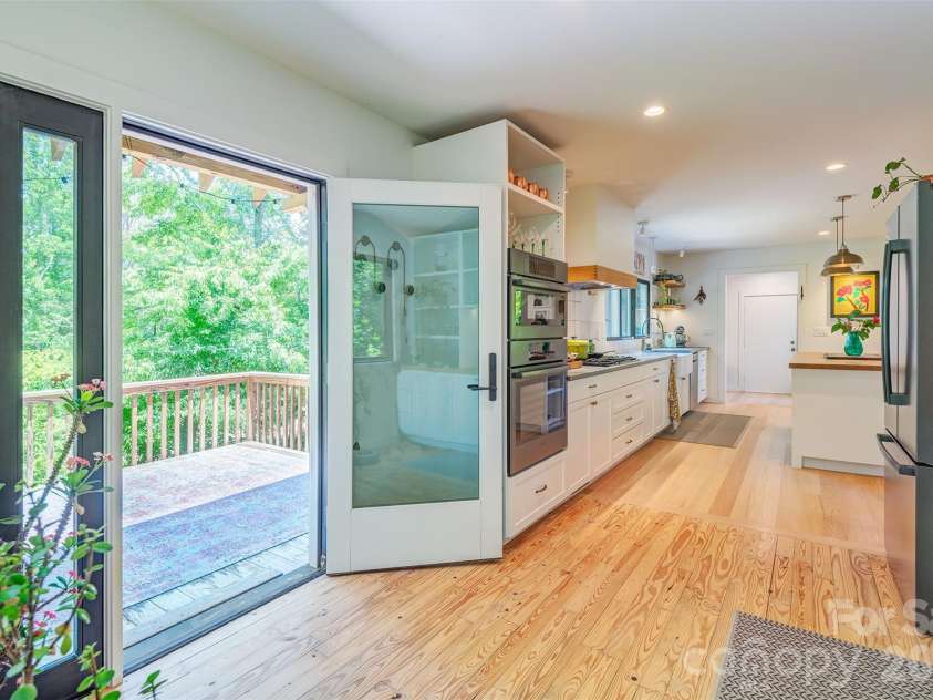 136 Graveyard Road, Fairview, NC 28730.  MLS# CAR4387672, YatesRealty ID 27249. Access to back deck from Kitchen