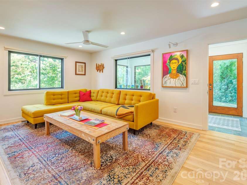 136 Graveyard Road, Fairview, NC 28730.  MLS# CAR4387672, YatesRealty ID 27249. Light Filled Living Room