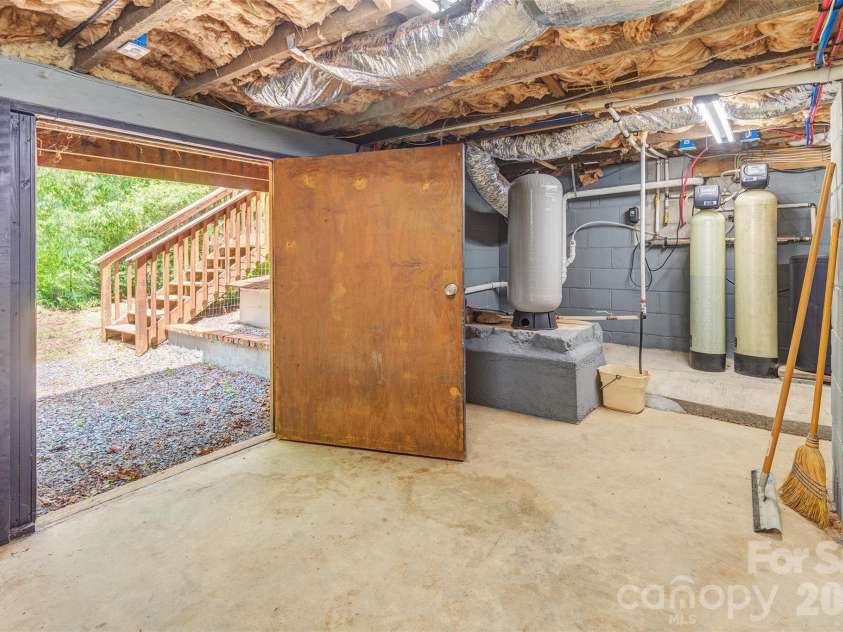 136 Graveyard Road, Fairview, NC 28730.  MLS# CAR4387672, YatesRealty ID 27249. Well pump/filters
