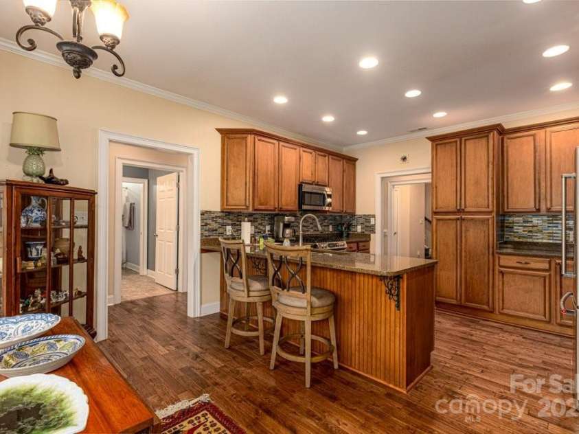 4004 3rd Court, Morganton, NC 28655.  MLS# CAR4269854, YatesRealty ID 27255. Kitchen offers ample counter space, granite countertops, island and eat-in area.