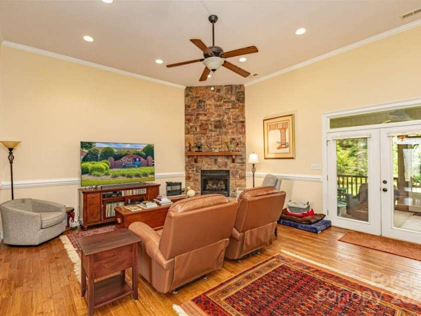 4004 3rd Court, Morganton, NC 28655.  MLS# CAR4269854, YatesRealty ID 27255. Living room with floor to ceiling gas fireplace.  Patio doors lead to your covered back porch allowing for evening gatherings or morning coffee.