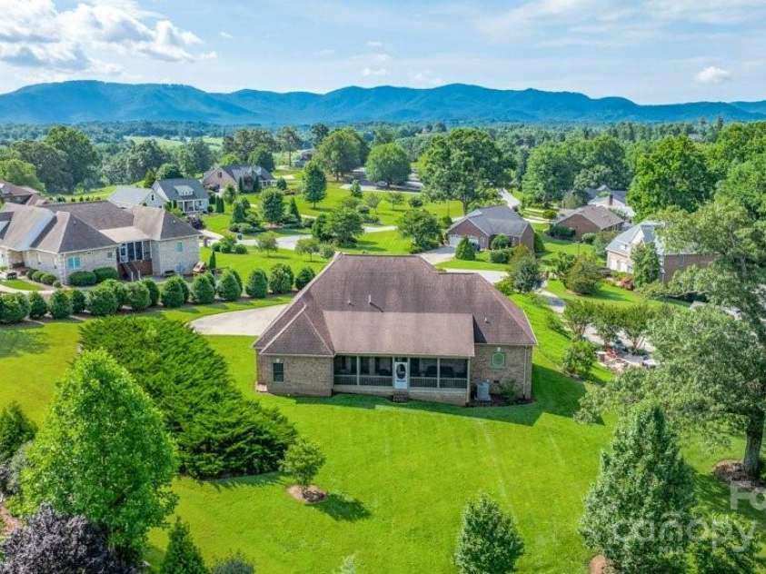 4004 3rd Court, Morganton, NC 28655.  MLS# CAR4269854, YatesRealty ID 27255. Nestled in a picturesque golf course community, this charming brick ranch offers the perfect blend of comfort and curb appeal. Set on a beautifully landscaped lot with views of the 16th green and surrounding countryside, th