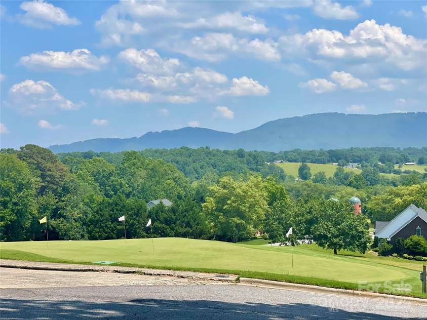 4004 3rd Court, Morganton, NC 28655.  MLS# CAR4269854, YatesRealty ID 27255. Nestled into gently rolling terrain, the golf course putting green features long range view.