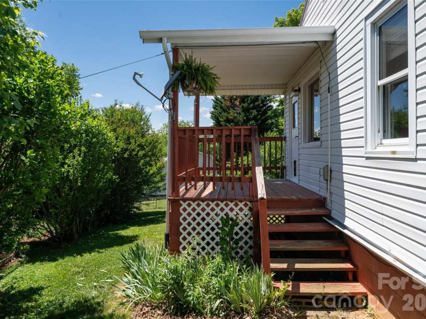 106 Aloha Circle Extension, Candler, NC 28715.  MLS# CAR4385168, YatesRealty ID 27258. Exterior back porch