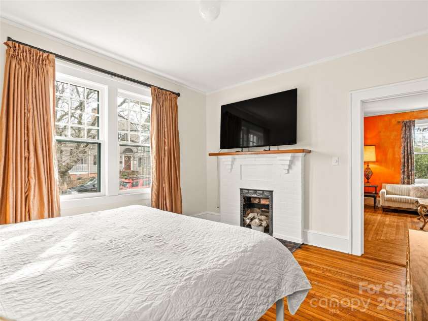 12 Bearden Avenue, Asheville, NC 28801.  MLS# CAR4331679, YatesRealty ID 2726. Original coal burning fireplace adorns this room.
