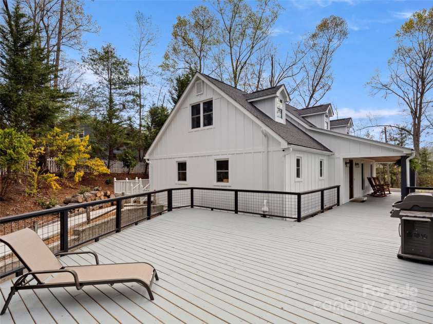 30 Gap Hill Drive, Fletcher, NC 28732.  MLS# CAR4249216, YatesRealty ID 27265. Beautifully expansive porch