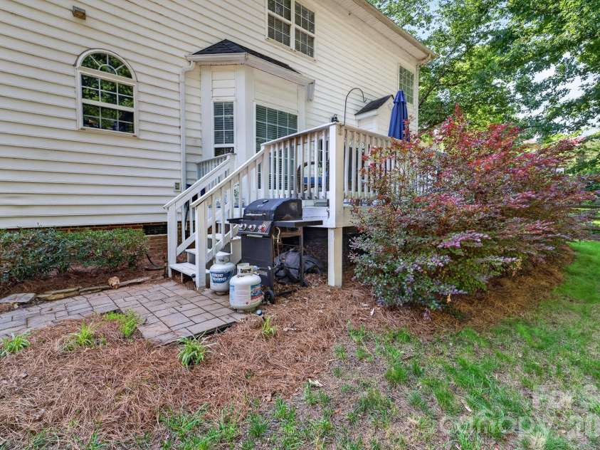 8812 Kingston Forest Drive, Charlotte, NC 28277.  MLS# CAR4374456, YatesRealty ID 27269. Follow the paver path to the firepit
