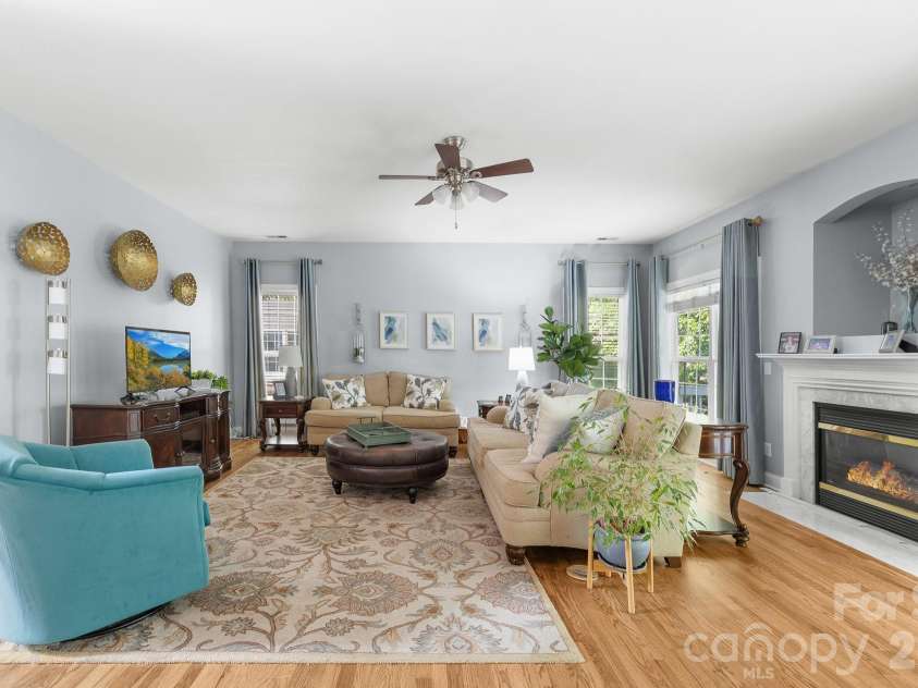 8812 Kingston Forest Drive, Charlotte, NC 28277.  MLS# CAR4374456, YatesRealty ID 27269. Open concept den with gas log fireplace