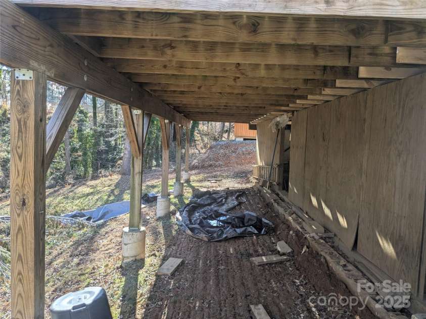 11 Kennedy Road, Weaverville, NC 28787.  MLS# CAR4219594, YatesRealty ID 2727. Exterior under deck