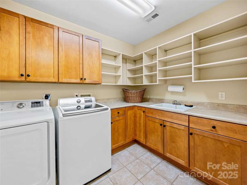 206 Summershade Court, Asheville, NC 28806.  MLS# CAR4282180, YatesRealty ID 27272. Large laundry on the lower level