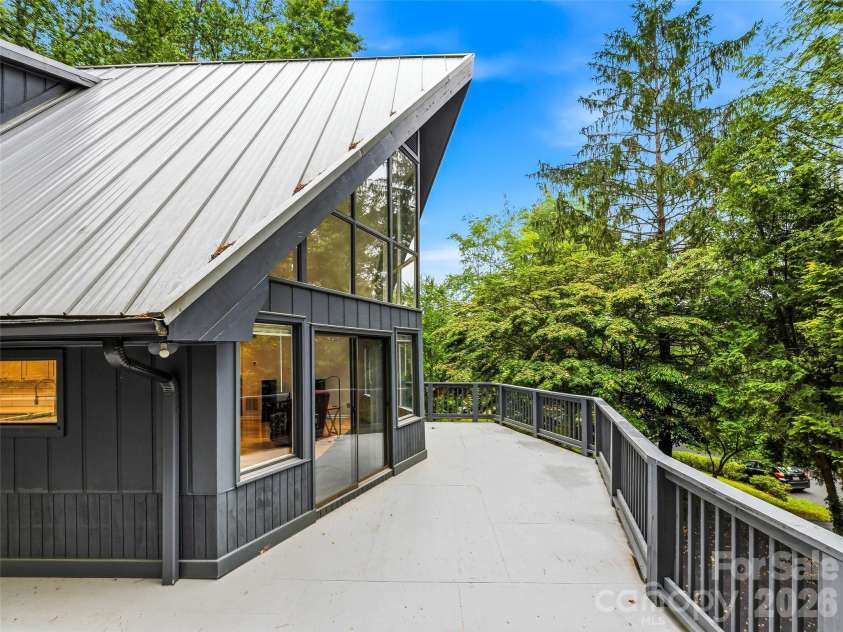 70 Skyline Drive, Hendersonville, NC 28791.  MLS# CAR4387179, YatesRealty ID 27276. The wrap around deck