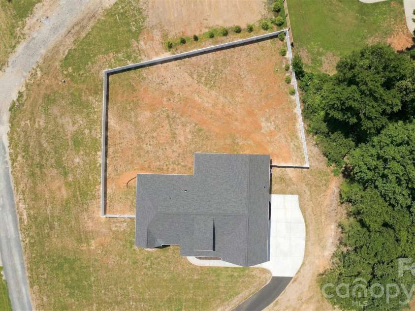 390 NC HWY 200 None, Stanfield, NC 28163.  MLS# CAR4383746, YatesRealty ID 27282. Backyard w/ privacy fence
