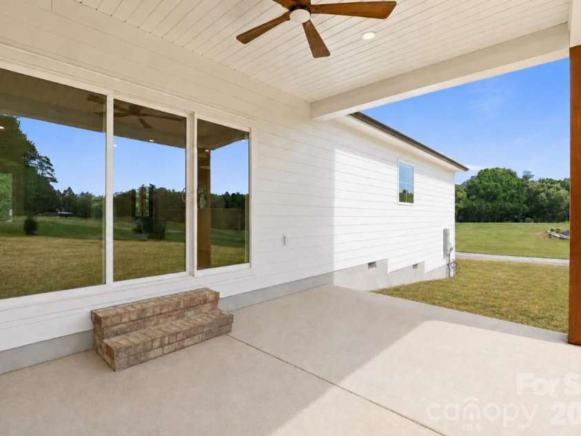 390 NC HWY 200 None, Stanfield, NC 28163.  MLS# CAR4383746, YatesRealty ID 27282. Covered back patio w/ solid oak post & ceiling fan*yard virtually updated
