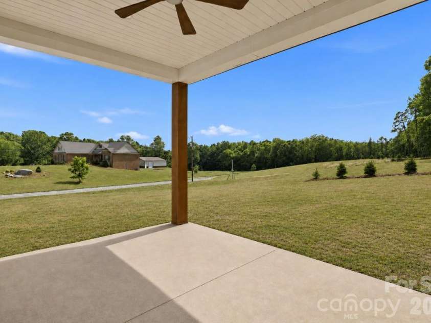 390 NC HWY 200 None, Stanfield, NC 28163.  MLS# CAR4383746, YatesRealty ID 27282. Covered back patio w/ solid oak post & ceiling fan*yard virtually updated