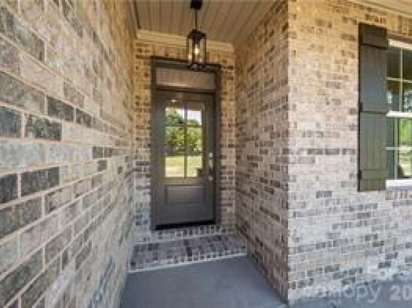 109 Frost Road, Advance, NC 27006.  MLS# CAR4388804, YatesRealty ID 27283. Front porch