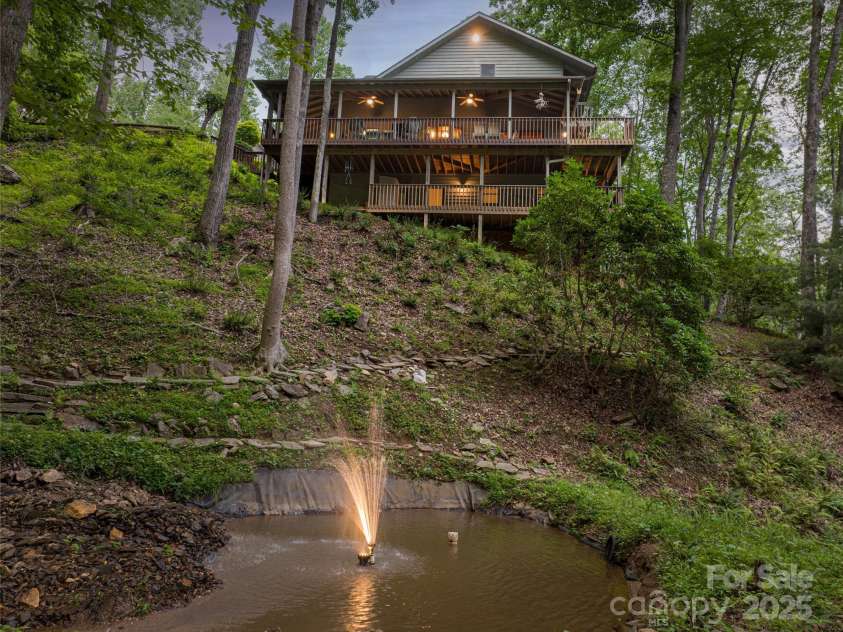163 Tweetys Knoll, Burnsville, NC 28714.  MLS# CAR4281512, YatesRealty ID 27283. Continuous ambience of a mountain stream and lighted pond