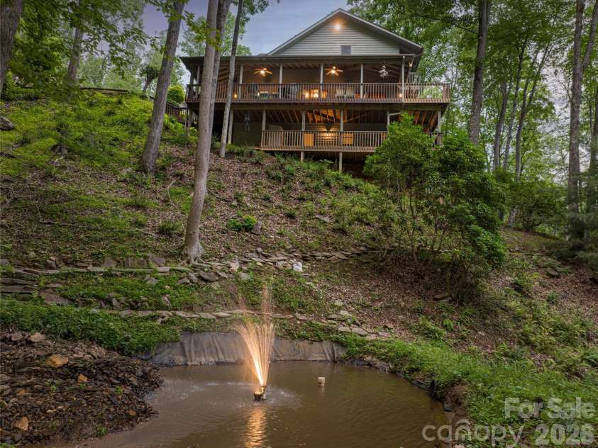 163 Tweetys Knoll, Burnsville, NC 28714.  MLS# CAR4281512, YatesRealty ID 27283. Continuous ambience of a mountain stream and lighted pond