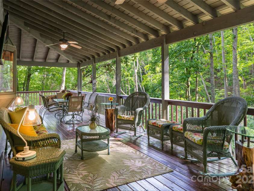 163 Tweetys Knoll, Burnsville, NC 28714.  MLS# CAR4281512, YatesRealty ID 27283. Covered deck on side is part of the fully wrap around deck (over 3000sqft of decking!)
