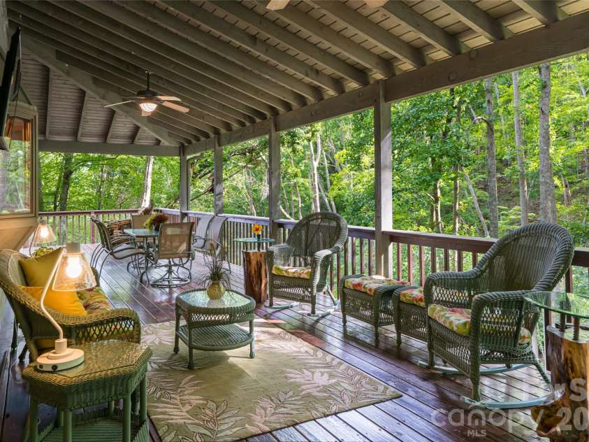 163 Tweetys Knoll, Burnsville, NC 28714.  MLS# CAR4281512, YatesRealty ID 27283. Covered deck on side is part of the fully wrap around deck (over 3000sqft of decking!)
