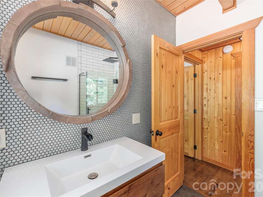 121 Mountainview Road, Asheville, NC 28806.  MLS# CAR4382985, YatesRealty ID 27293. Custom Tile Wall in Bathroom