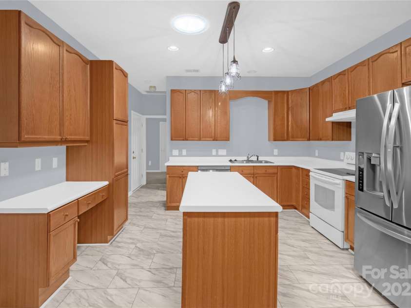 4467 Antelope Lane, Charlotte, NC 28269.  MLS# CAR4260461, YatesRealty ID 27294. Kitchen with 2 sun tunnels